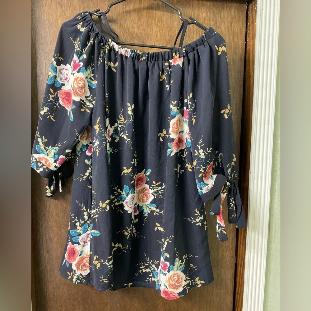 Woman’s off the shoulder top, navy blue